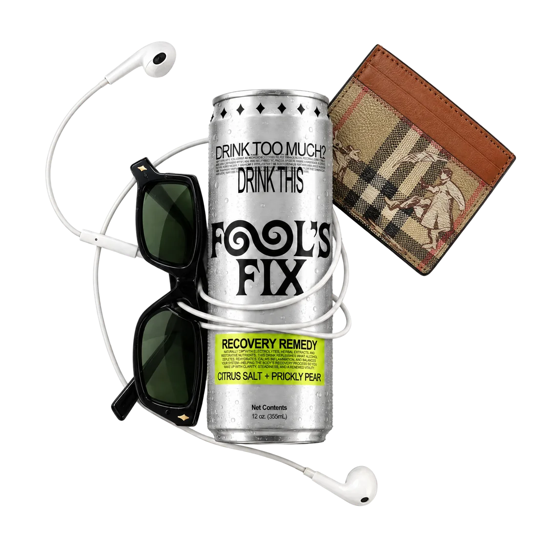 A can of Fool's Fix with black sunglasses, earphones and a leather wallet