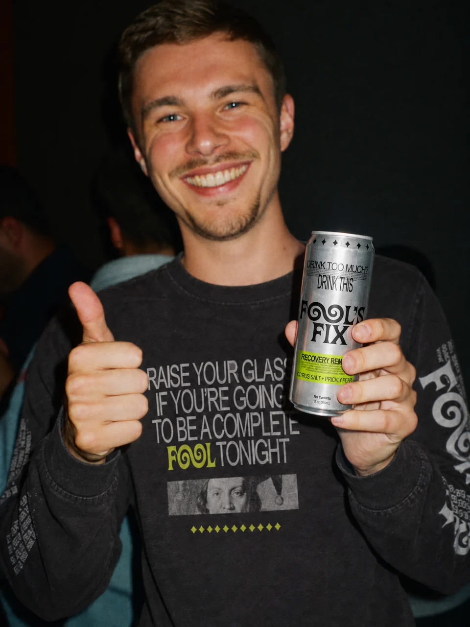 Johnny smiling with a can of Fool's Fix and a thumbs up